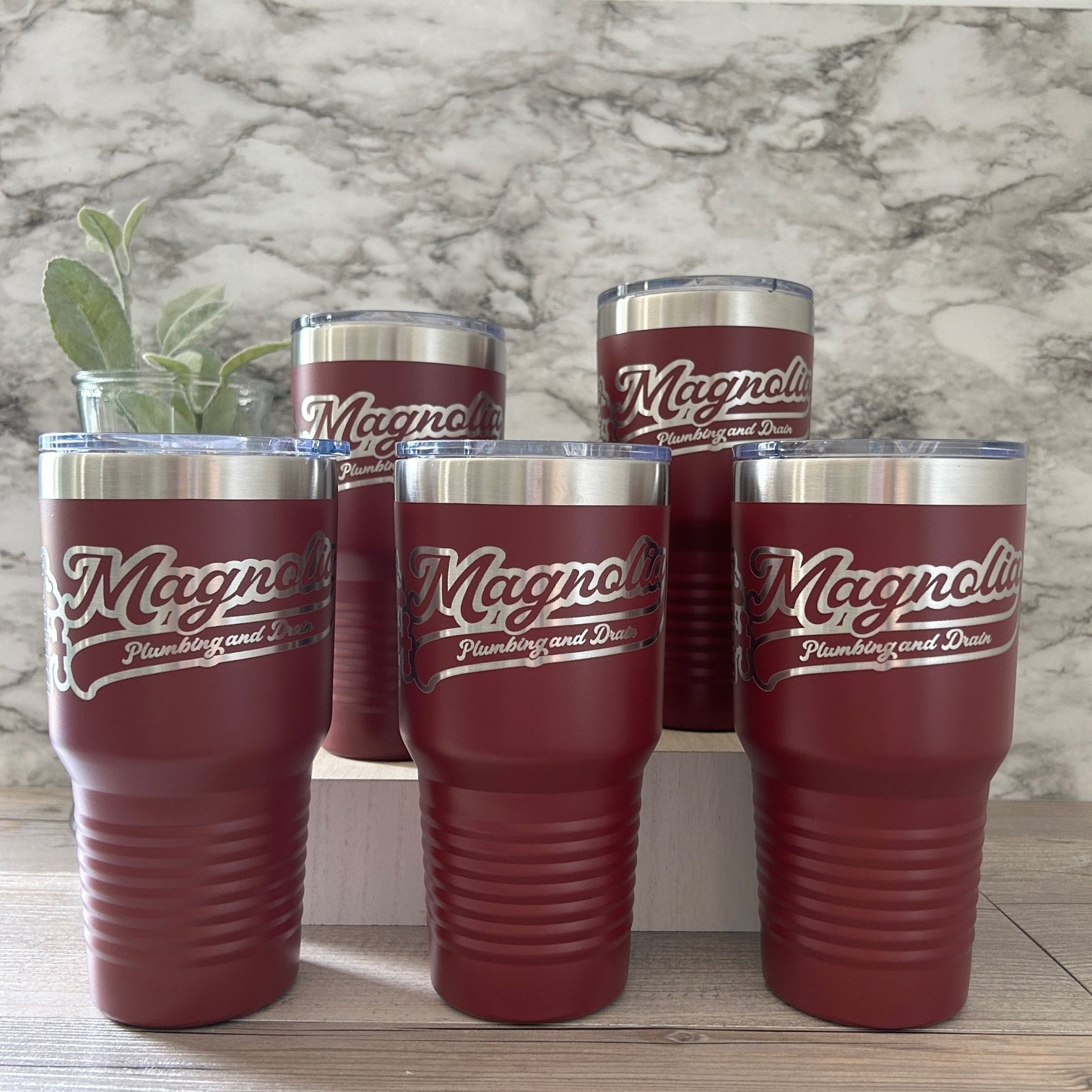 Business logo engraved on 30oz tumblers.