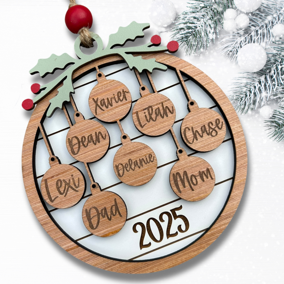 Wooden Christmas ornament with engraved names and '2025' on a white background.