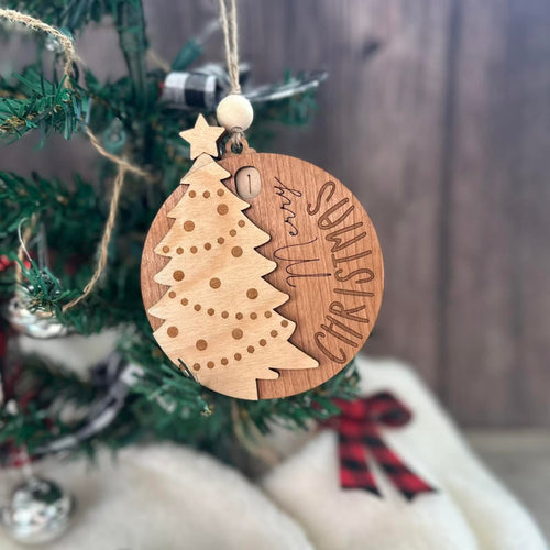 Counting down the days to Christmas ornament with a tree on the front.
