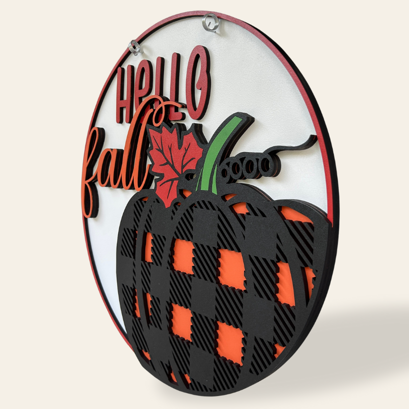 Decorative sign with 'Hello Fall' text and a pumpkin design on a white background