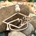 Graduation cap ornament with the graduation year in the middle.
