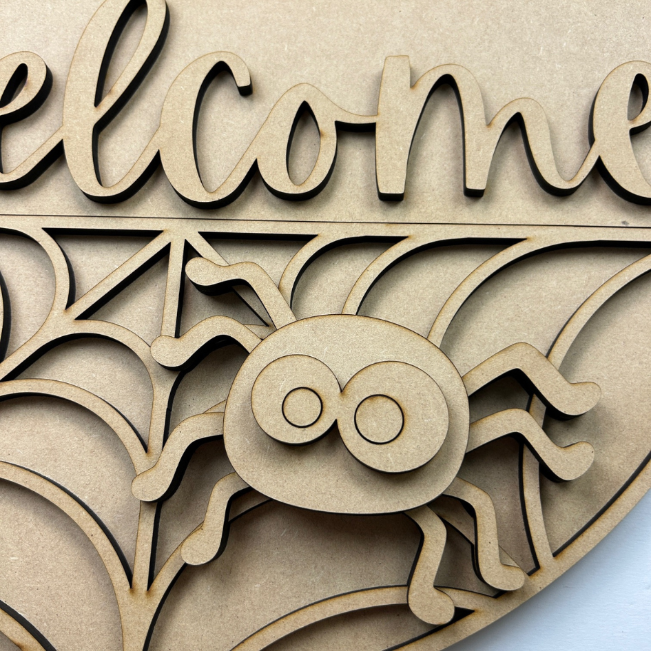 Wooden decorative sign with 'Welcome' text on a wooden background