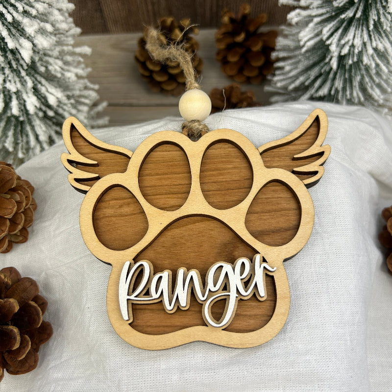 Memorial dog paw ornament with angle wings.