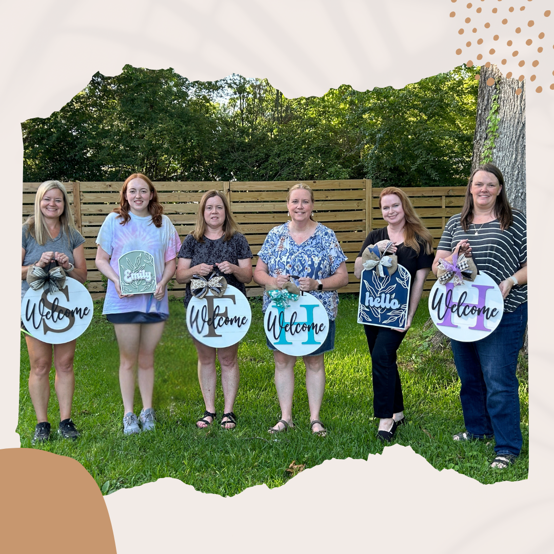 Happy customers with their finished signs.