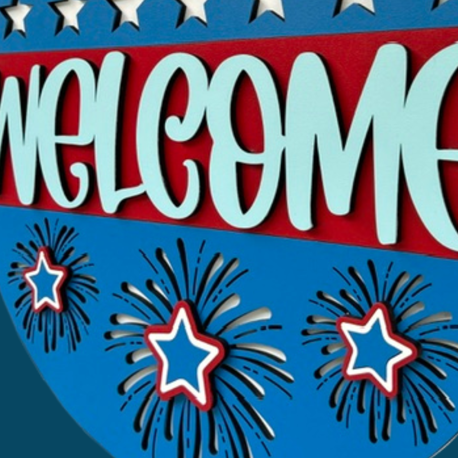 Decorative sign with 'WELCOME' text, stars, and fireworks on a blue and red background.
