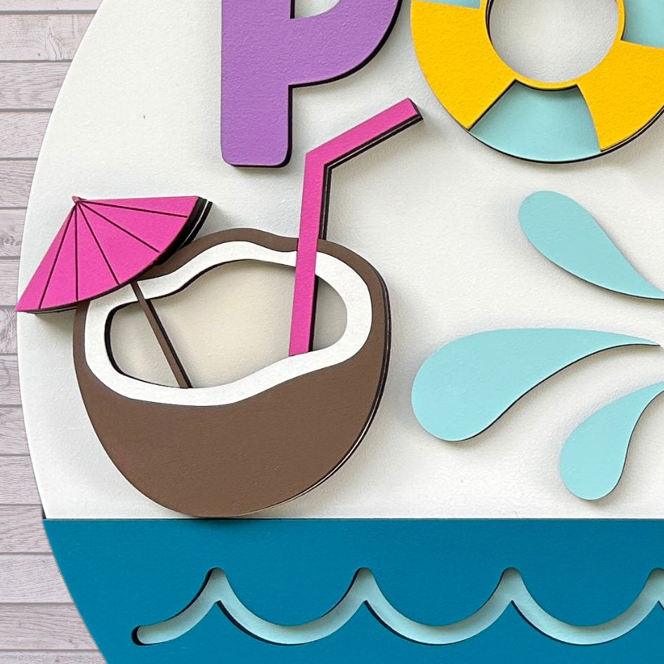 Close up of the coconut drink showing the 3d layers on the summer door sign.