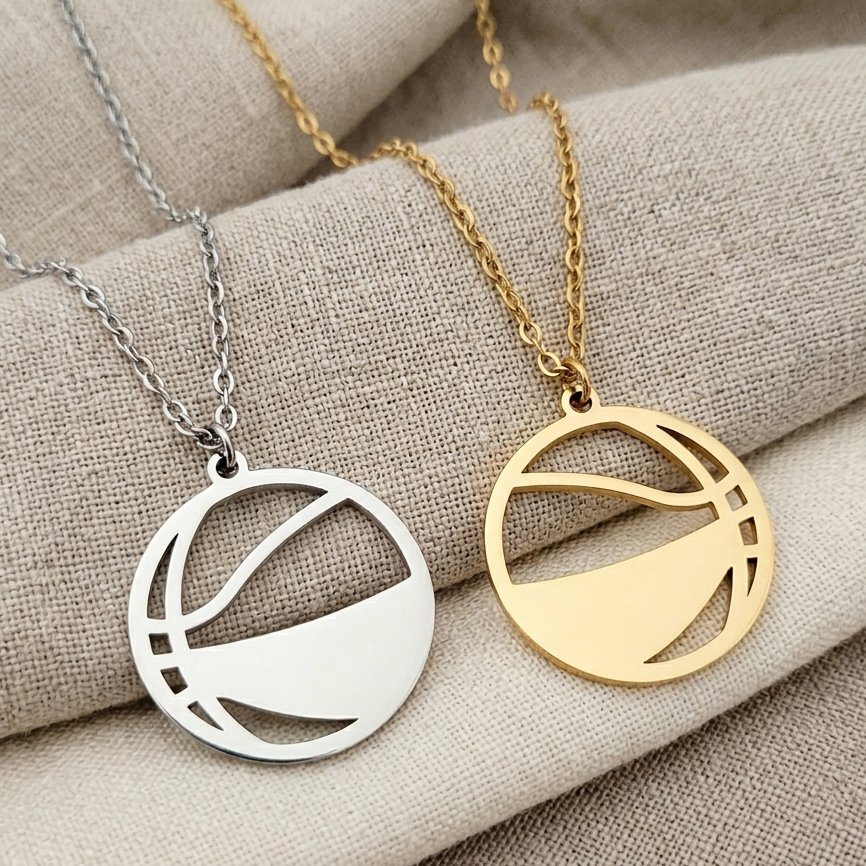 Two necklaces with circular pendants on a beige fabric background