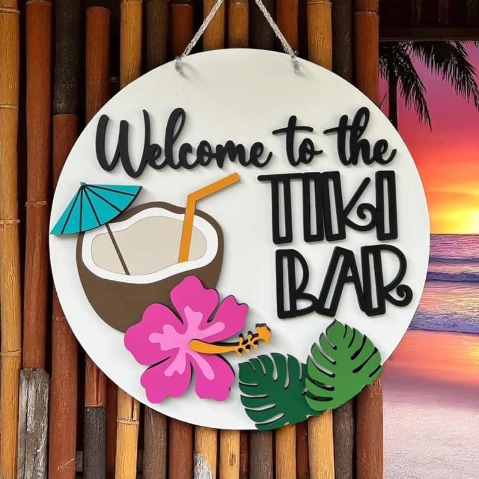 Round decorative sign with 'WELCOME' text and star designs, set against a sunset sky.