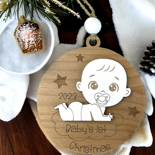 Baby's first Christmas ornament with a cute baby on a cloud.