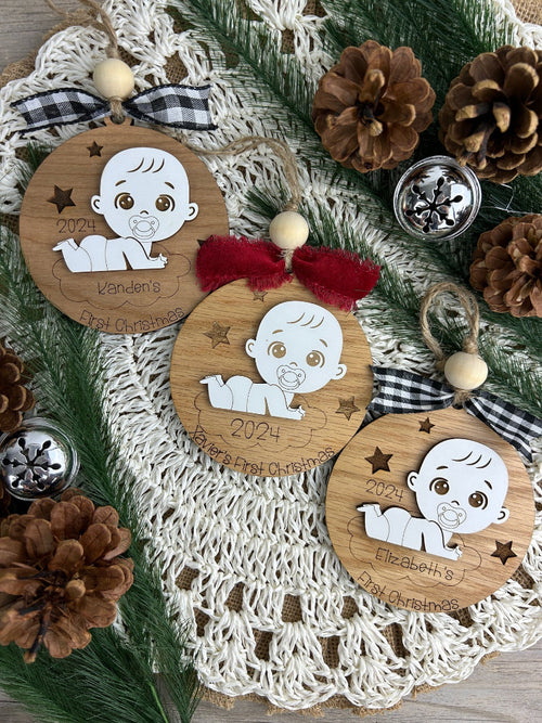 Baby's first Christmas ornament with a cute baby on a cloud.