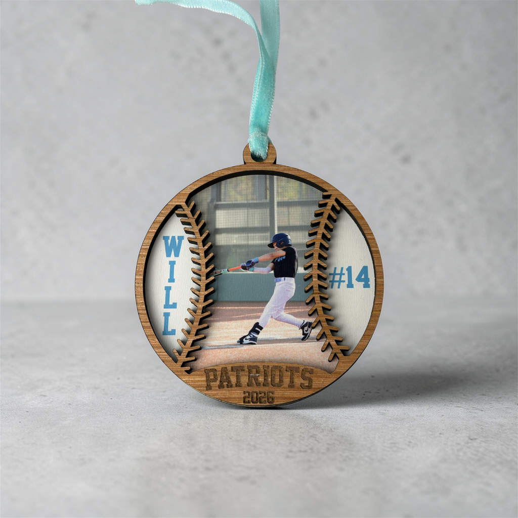 Wooden ornament with a baseball player image and text on a gray background