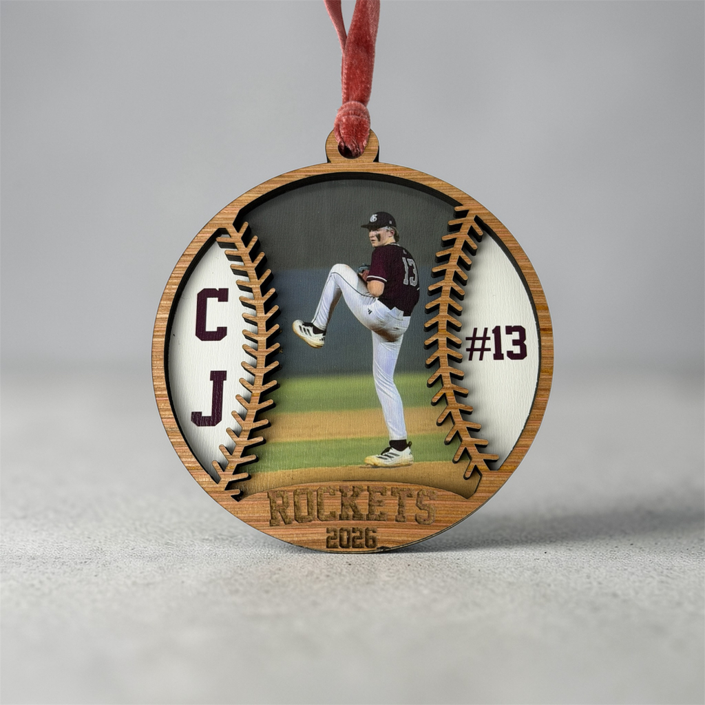 Wooden ornament with a baseball player image and 'Rockets' text on a gray background