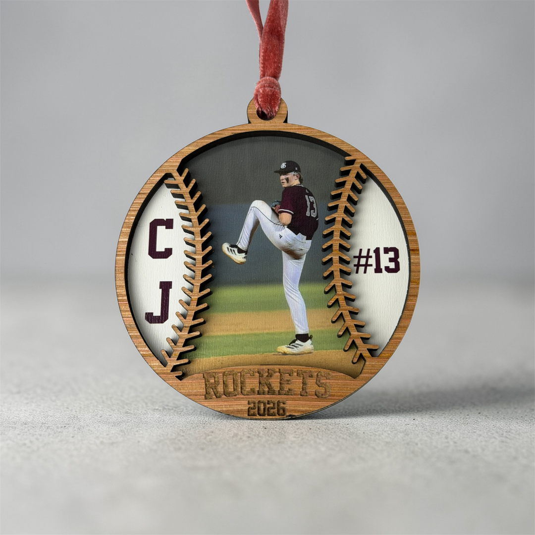 Wooden ornament with a baseball player image and 'Rockets' text on a gray background