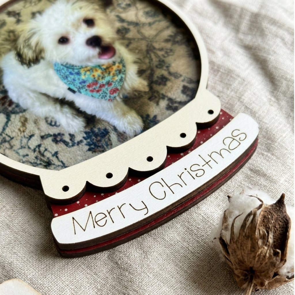 Decorative photo frame with a dog inside, featuring 'Merry Christmas' text on a textured surface.