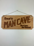 Dad's man cave sign carved out of wood and hanging on a wall.