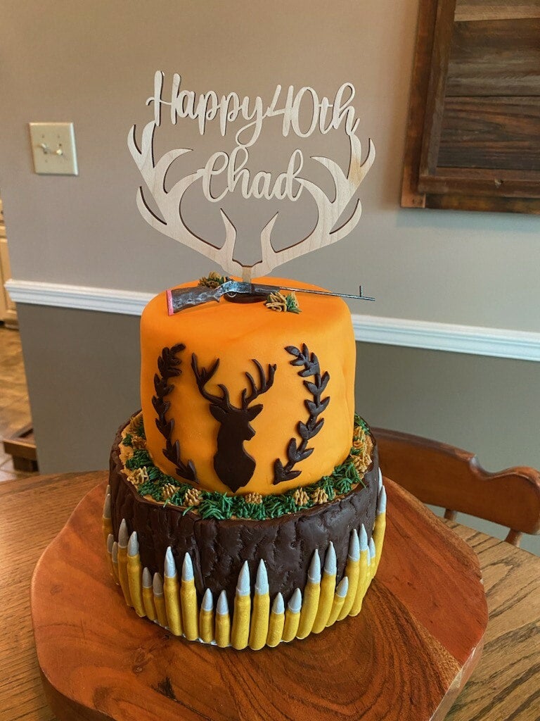 Deer Antler Cake Topper in a beautifully decorated cake.