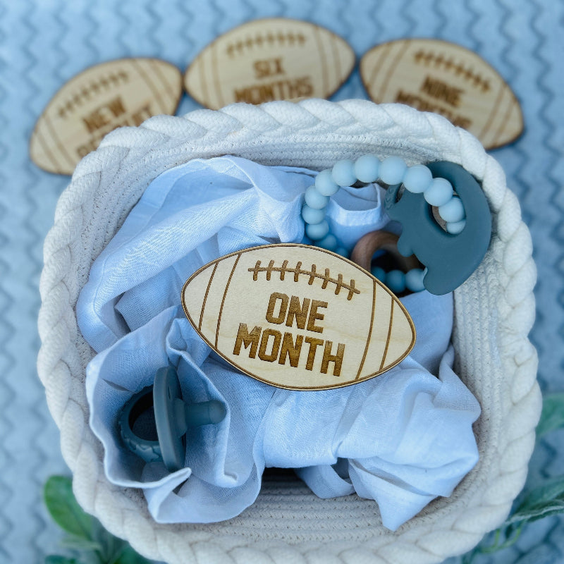 One month football milestone for a babies monthly photo.