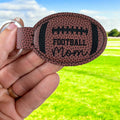 Leatherette football mom keychain.
