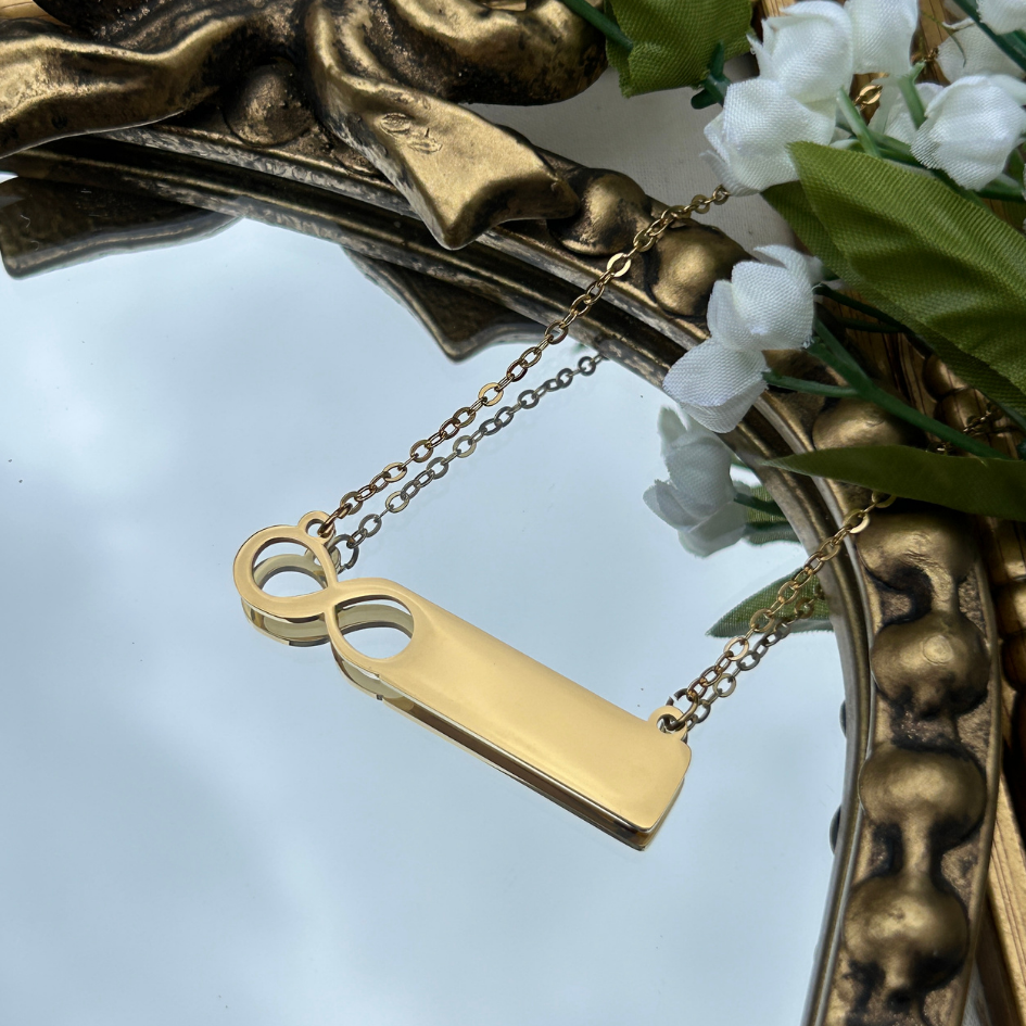 Gold pendant with chain on a decorative background