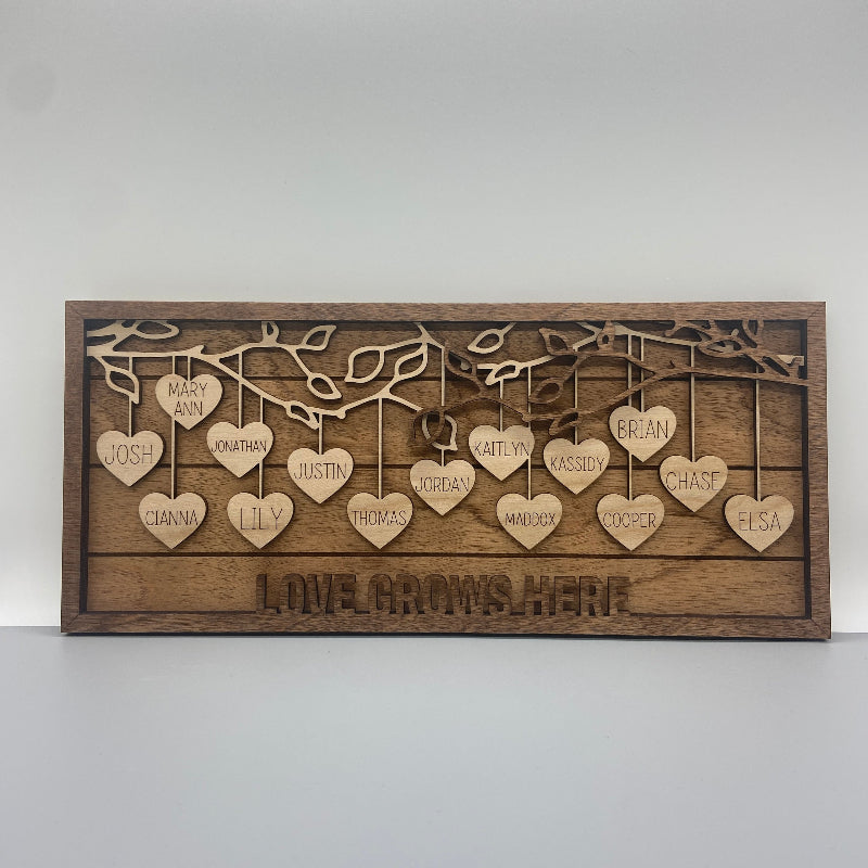 Hanging hearts frame with several family names.
