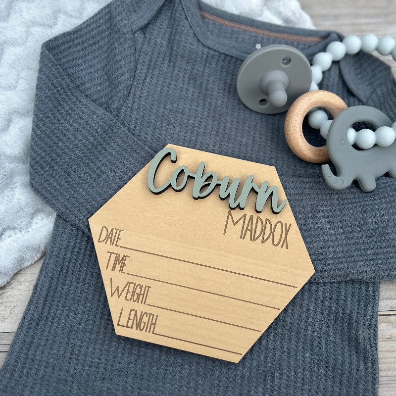 Hexagon shaped new baby name announcement.