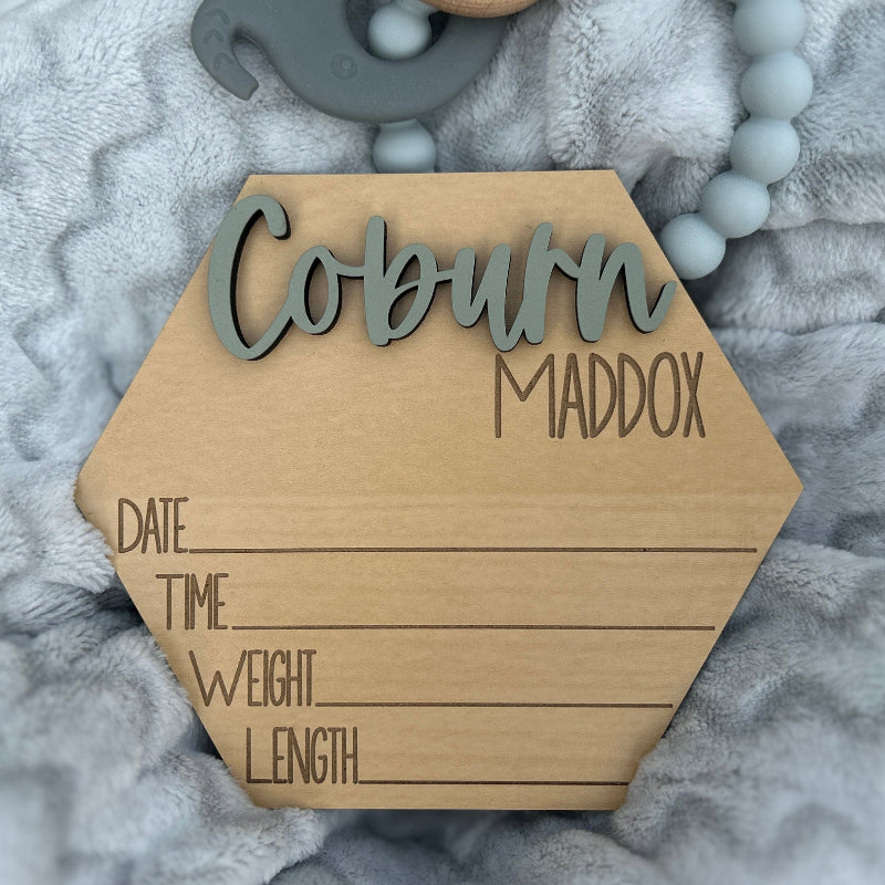Hexagon shaped new baby name announcement.