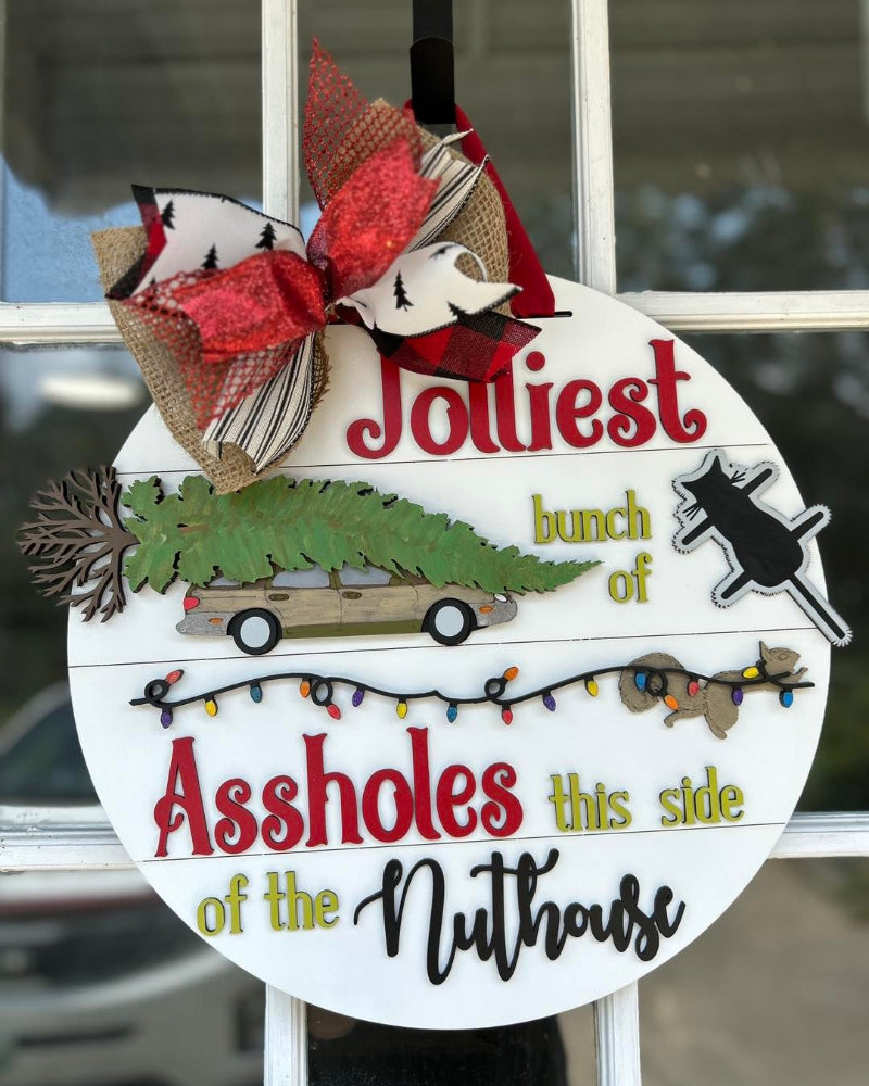 Jolliest bunch of finished door sign.