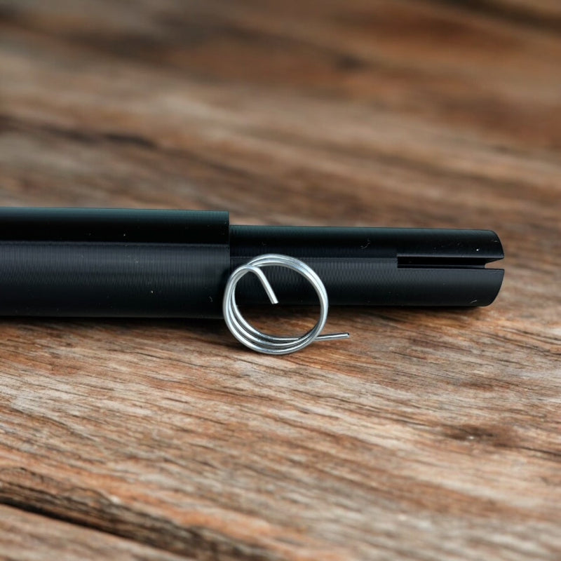 Sample wire curled laying in front of the large wire curling wand.