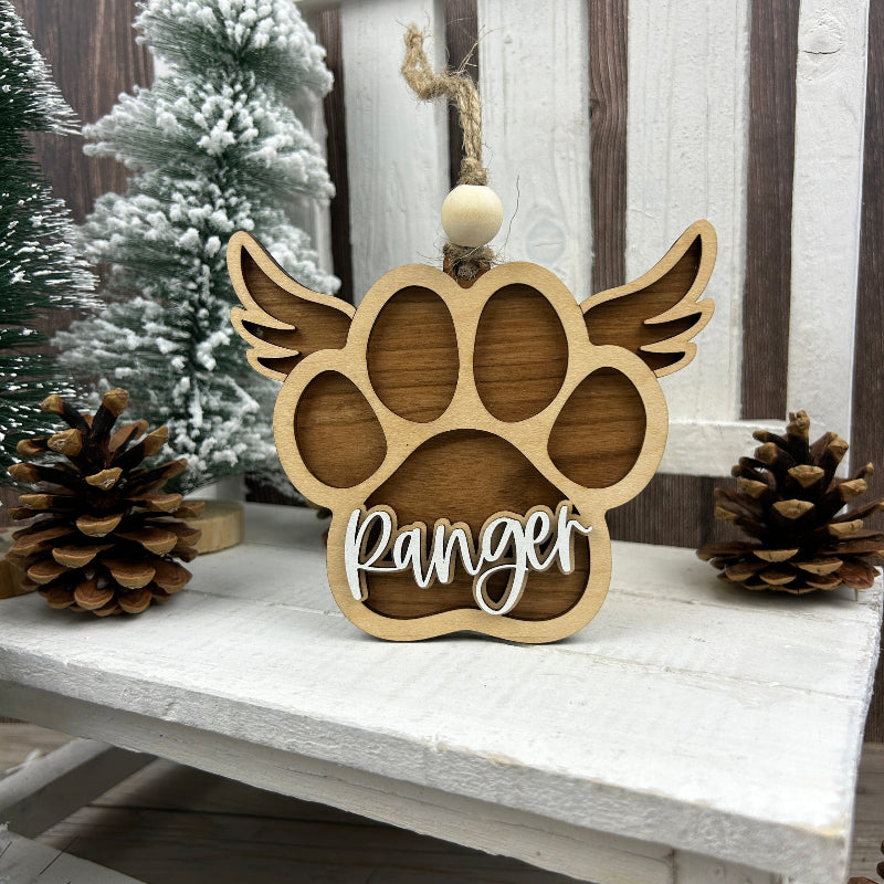 Memorial dog paw ornament with angle wings.