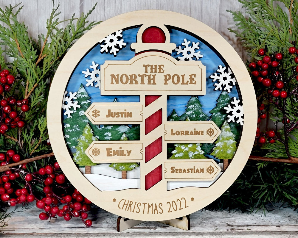 Round version of the North Pole Family sign.