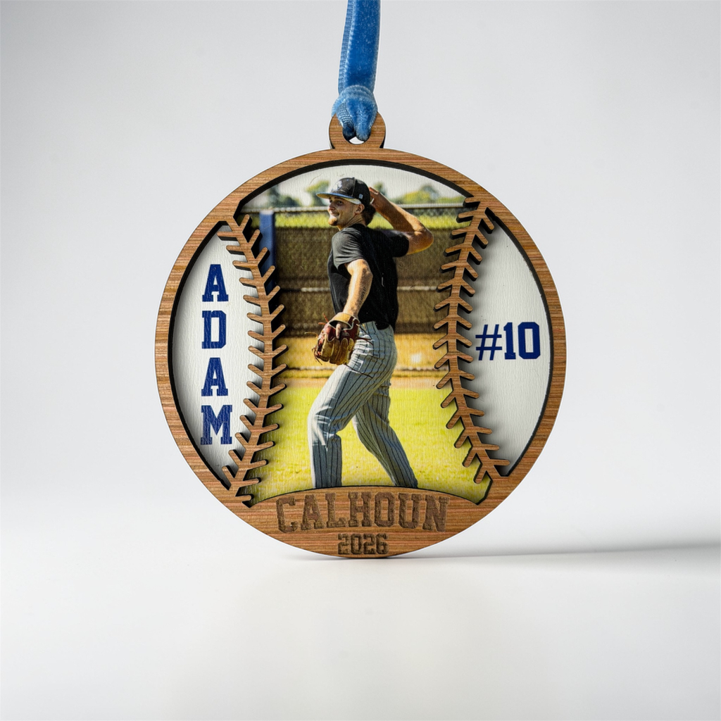 Wooden ornament with a baseball player image and text on a white background