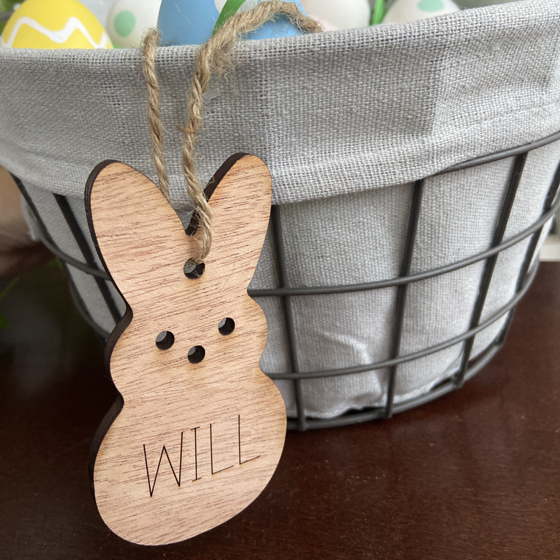 Easter bunny tag hanging on an Easter basket.