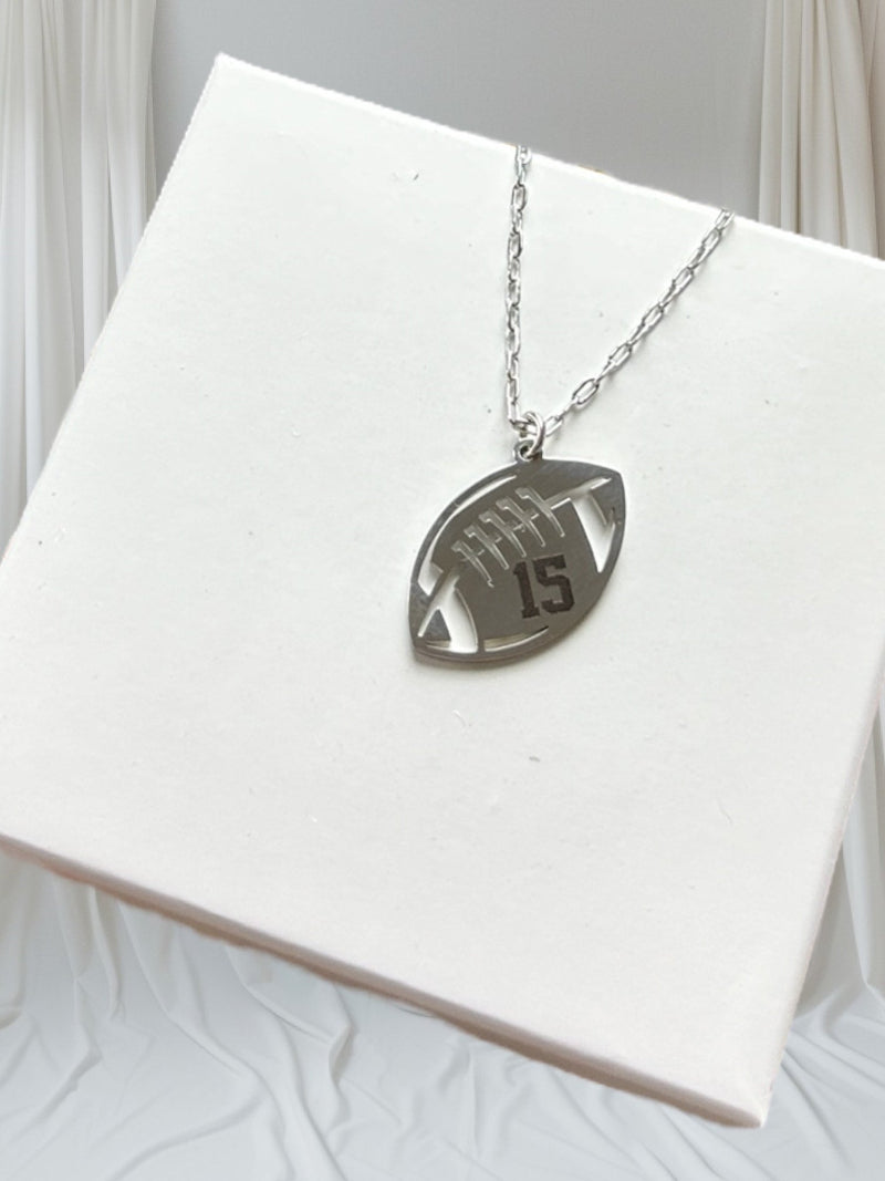 Silver stainless steel engraved necklace on a giftbox.
