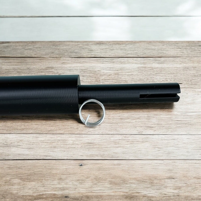 Sample wire curled laying in front of the small wire curling wand.