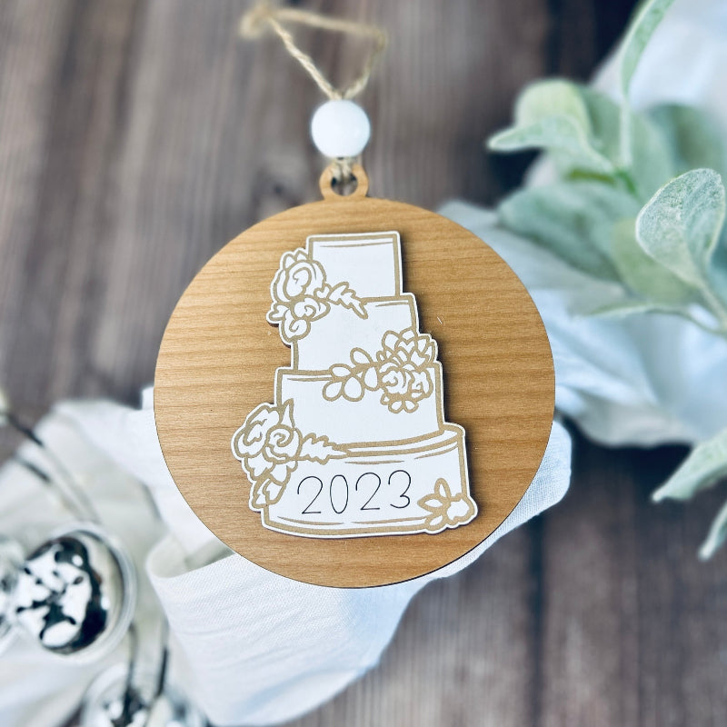 Just Married Cake ornament with the year the bride and groom had their wedding.
