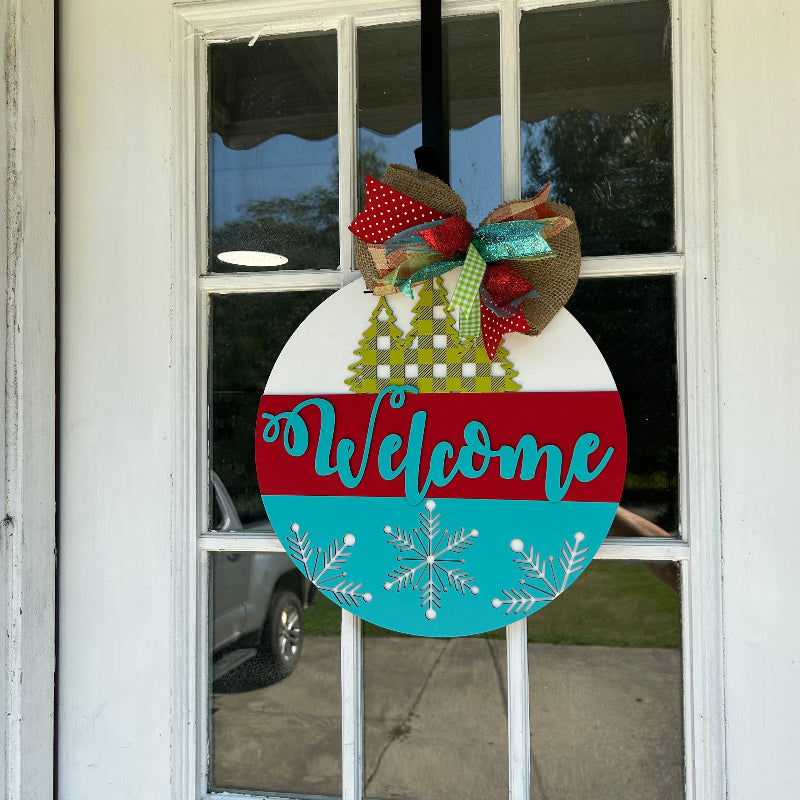 Buffalo Plaid Pine Tree design Welcome sign hanging on a front door.