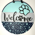 Puppy Dog Welcome sign hanging on a front door.