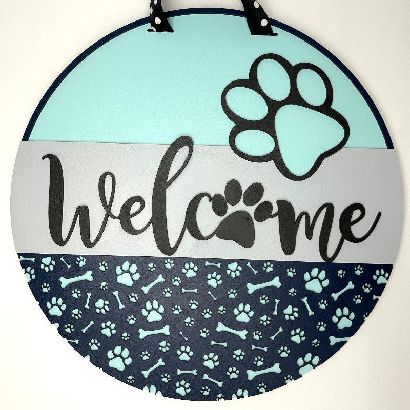 Puppy Dog Welcome sign hanging on a front door.