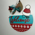 Welcome door sign with the Christmas Story Ralphie's tobogan and broken glasses.
