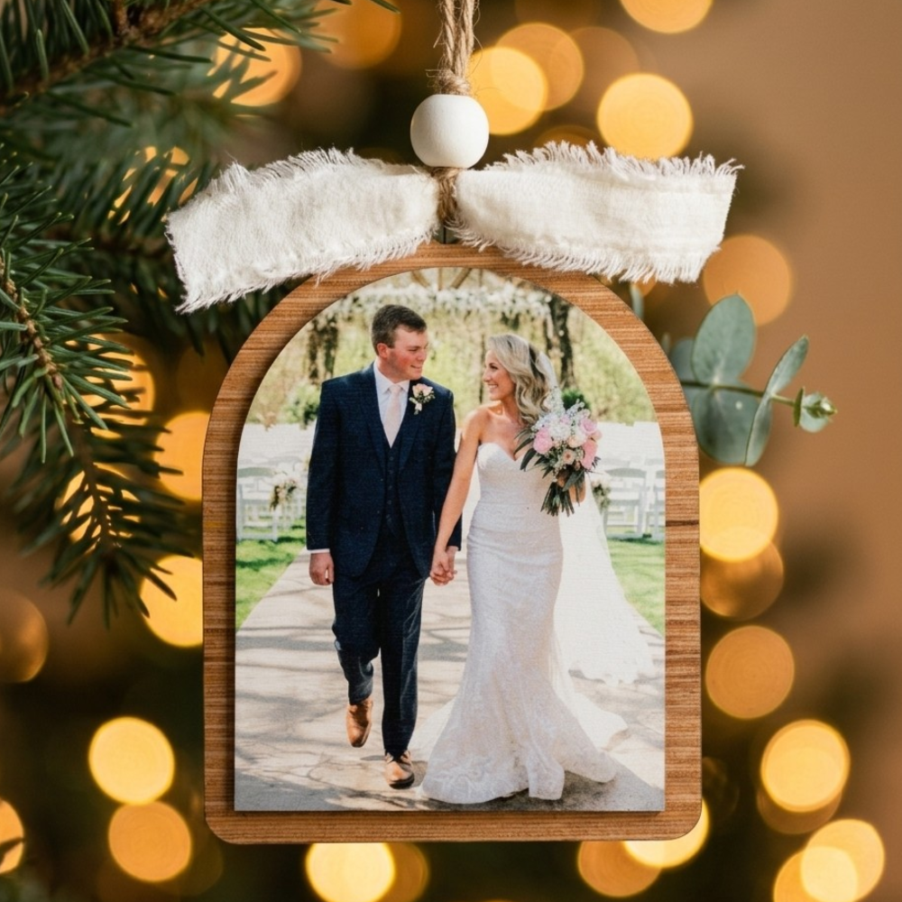 Wedding photo on a wooden ornament with a blurred festive background